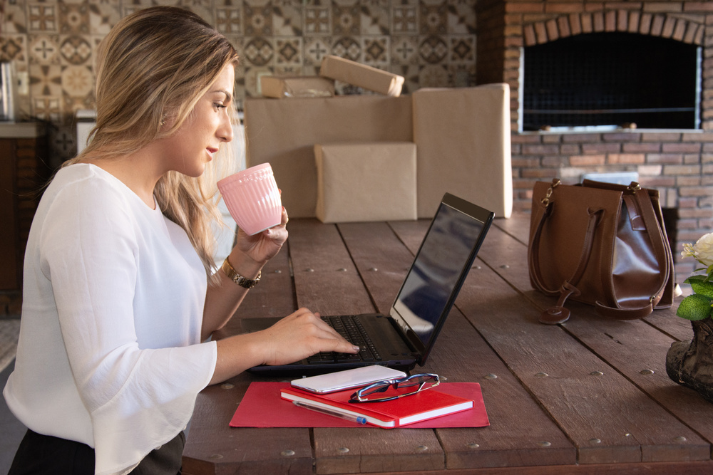 woman home office notebook